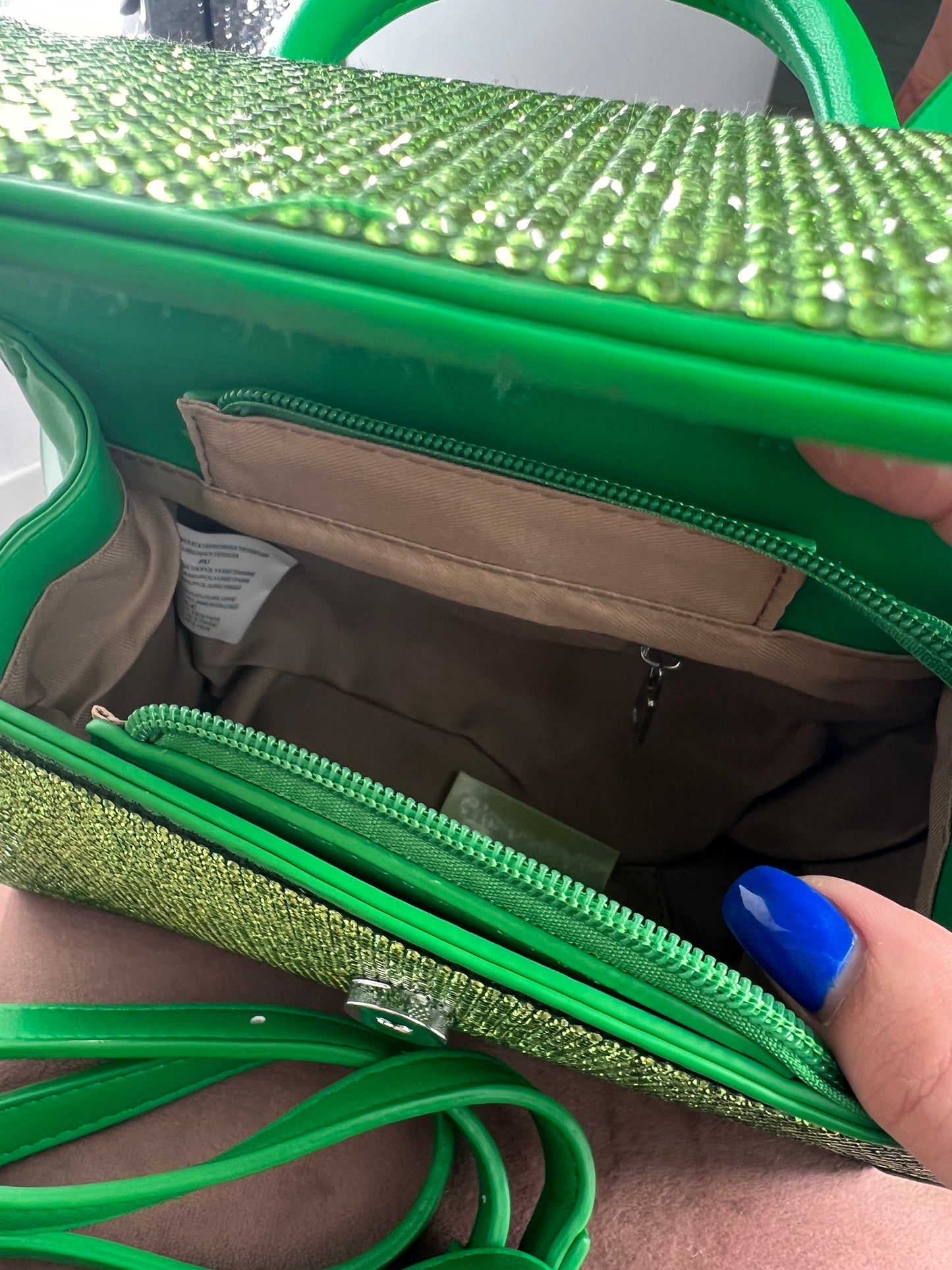 Borsa verde con tracolla brillantinata